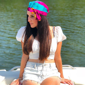 katie wears Bold Clothing's Band of gold Headwear on a boat |  #sayitinbold @boldornaked shop online at www.boldornaked.com | Bold Headwear