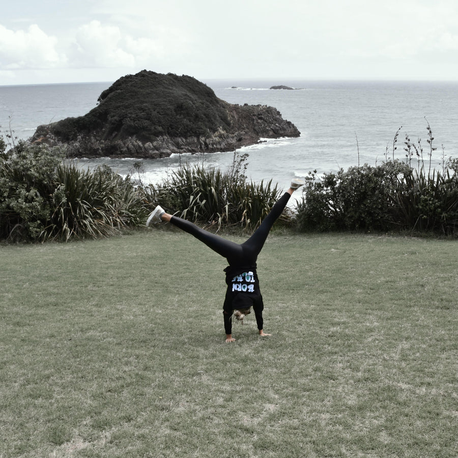 Kate cartwheels in Bold's Born to be Bold sequin hoodie in New Plymouth New Zealand  Bold Clothing - Unique Bamboo Clothing & Streetwear | #sayitinbold @boldornaked shop online at www.boldornaked.com